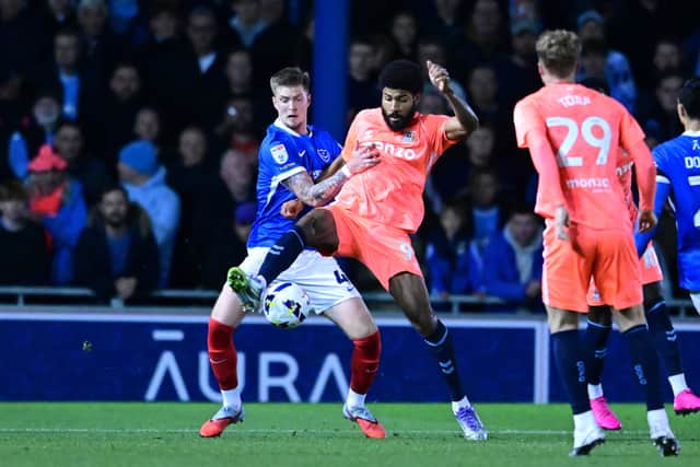 Josh Knight, pictured tussling with Ellis Simms against Coventry City, had made five successive starts for Pompey before Stoke. Picture: Dennis Goodwin/ProSportsImages