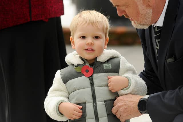 Finley Pook (2) receiving the first poppy at the launch of the Hampshire Poppy Appeal in Portsmouth.