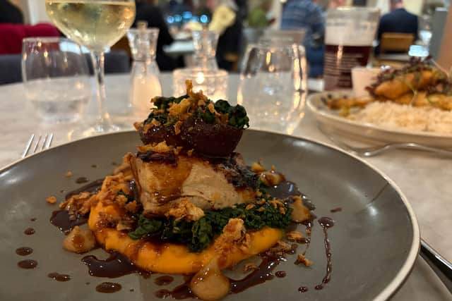 Confit pork belly with sweet potato, caramelised onion, apple sauce and crackling - a triumph of a dish at The Greenbank