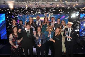 The winners of the 14 categories celebrate together on the stage.