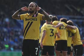 Sorba Thomas and the Stoke players celebrate at Fratton Park