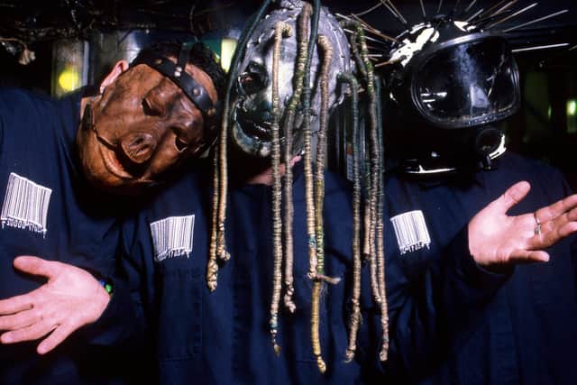 American musicians Paul Gray, Corey Taylor and Craig Jones of Slipknot, backstage at Brixton Academy, London, 5th March 2000.