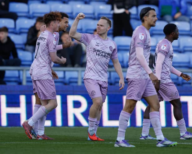 Former Pompey winger Anthony Scully celebrates his goal for Shrewsbury Town at Oldham last weekend. 
