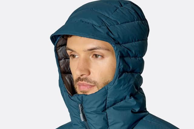 The hood stays on well while the coat is fully-zipped, but it can blow off easily if not