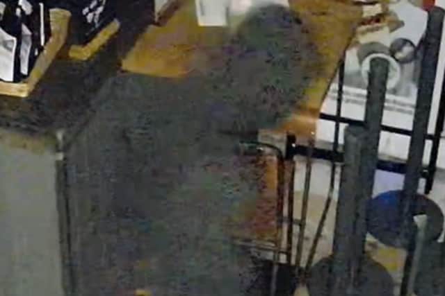 CCTV image of a man breaking into Baffled Coffee in Southsea.