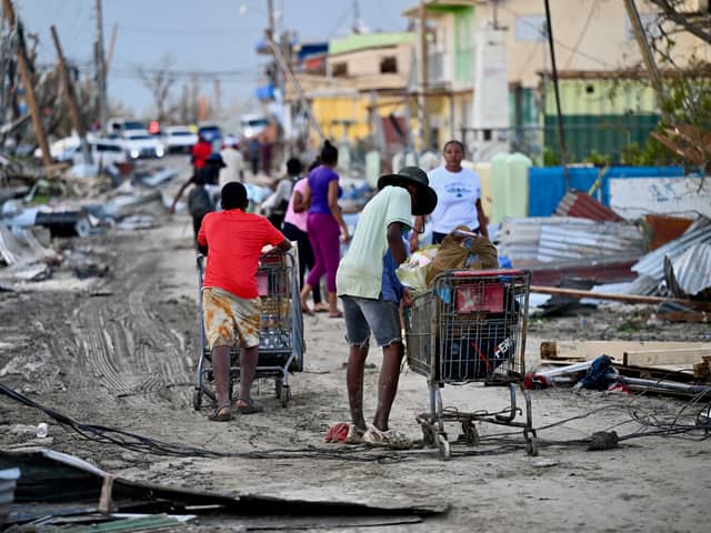 Heartbroken sailors spoke of their pride in supporting those impacted by Hurricane Melissa in Jamaica, after Portsmouth-based HMS Trent was deployed to the region. Pictured: Black River residents are scavenging for food on the streets of Black River following the passage of Hurricane Melissa, in Santa Cruz, St Elizabeth, Jamaica on October 29, 2025. 