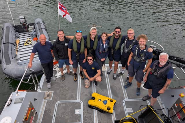 Naval personnel and conservationists.