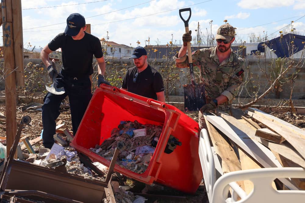 Ships company help to clear out the female surgical ward at Falmouth Hospital, the roof had collapsed during hurricane Melissa. 