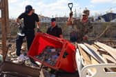 Ships company help to clear out the female surgical ward at Falmouth Hospital, the roof had collapsed during hurricane Melissa. 