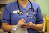 A nurse in the accident and emergency dept of Selly Oak Hospital in Birmingham. Around 18,000 staff roles are being cut in England as part of a major reorganisation (Photo: Christopher Furlong/Getty Images)