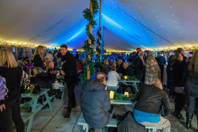 Crowds get in to the festive mood at Kings at the Queens at the hotel's Winter Lodge.