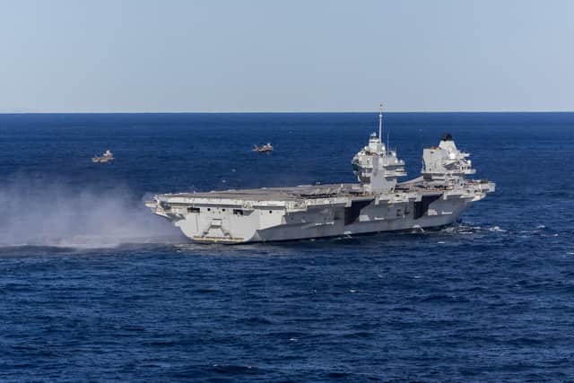 HMS Prince of Wales joined forces with the Italian aircraft carrier ITS Cavour during Exercise Neptune Strike. Pictured are two fighter jets landing on the Royal Navy flagship following a fly over with Italian Navy F-35B and AV-8B Harrier II Jets.