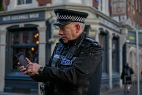 Pictured: Chief Inspector, Marcus Cator with the UKPAC app on his phone at Guildhall Walk, Portsmouth