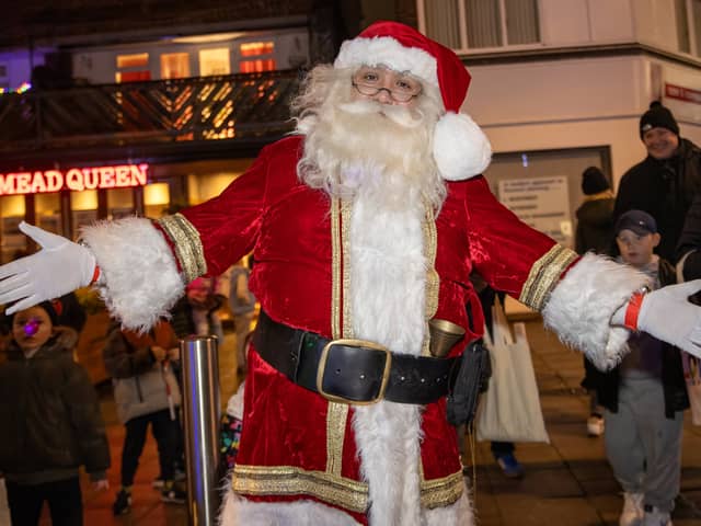 Santa Clause arrived to turn on the lights