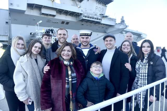 Pictured is: (middle) Leading Hand Joseph Mellor was the first sailor to step ashore from HMS Prince of Wales. He was greeted by mum Karen (fifth from left) and the rest of his family.
