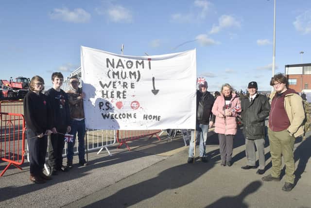 Pictured is: (l-r) Edward Harvey, George Harvey, Henry Harvey, Stuart Harvey, Linda Elsworth, Nigel Elsworth and Daniel Harvey waiting for PO Naomi Harvey from Lee-on-the-Solent who has served in the Royal Navy for 28 years.