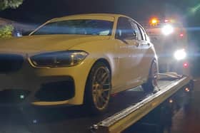 A white BMW was seized by Hampshire police officers in Slough after being linked at dangerous driving at a car meet in the county.