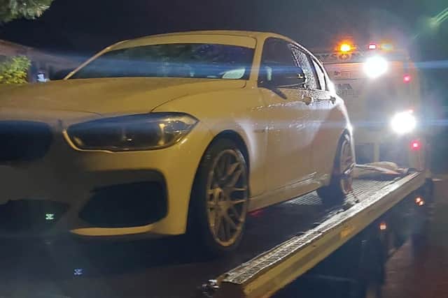 A white BMW was seized by Hampshire police officers in Slough after being linked at dangerous driving at a car meet in the county.
