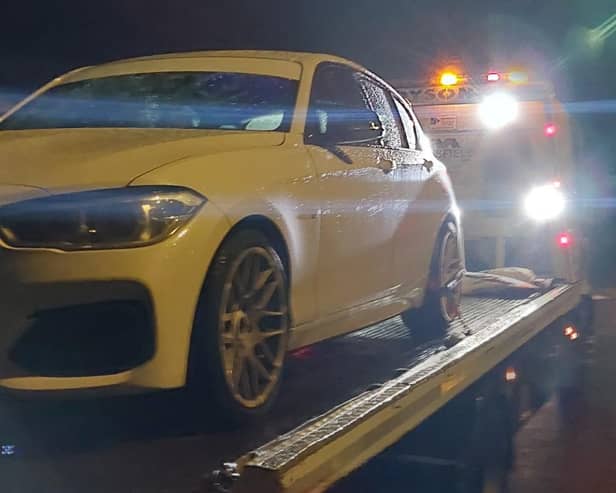 A white BMW was seized by Hampshire police officers in Slough after being linked at dangerous driving at a car meet in the county.