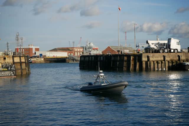 A Rattler-class boat sailing in HMNB Portsmouth.