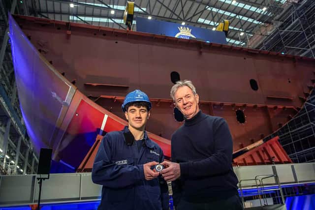 Apprentice Joolz Hunter and Babcock CEO Sir Nick Hine with the commemorative coin to be placed under HMS Formidable's keel