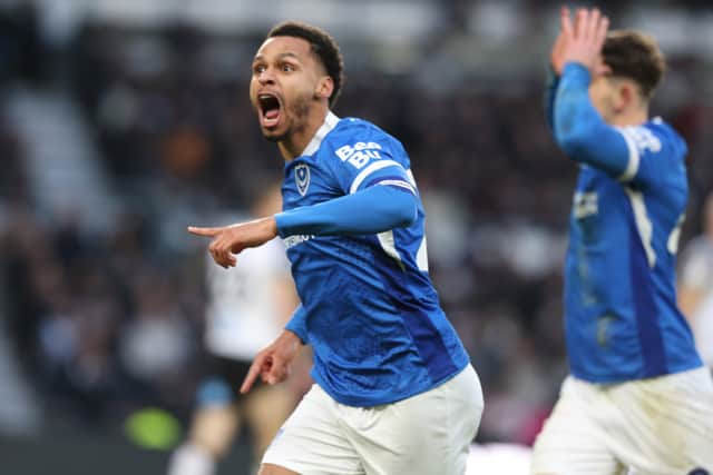 Josh Murphy celebrates with the Pompey fans after Callum Lang's opener.