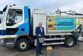 Cllr Ian Bastable with new food waste collection vehicles and caddies to be delivered to Fareham Borough Council residents