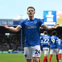 Terry Devlin lapping up the applause of the Fratton faithful following his goal against QPR