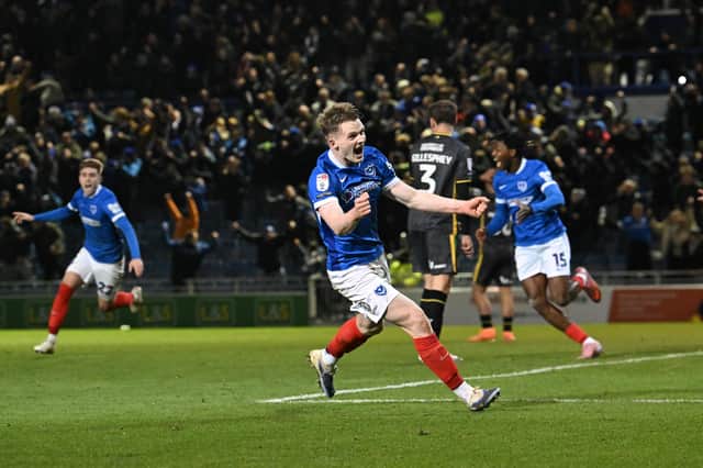 Pompey celebrate Minhyeok Yang's 98th-minute winner. Picture: Graham Hunt/ProSportsImages