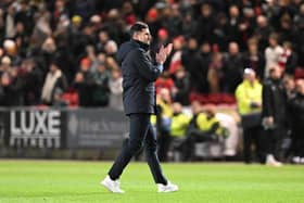 Pompey boss John Mousinho applauds the travelling fans after the Bristol City thrashing. Pic: Graham Hunt/ProSportsImages