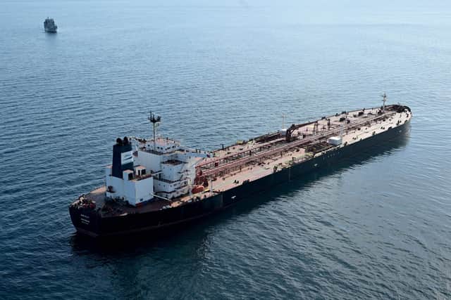 UK politicians believe they can legally stop shadow fleet tankers by using the Royal Navy and armed forces. Pictured: October 1, 2025 off the coast of the western France port of Saint-Nazaire shows the tanker Boracay from Russia's so-called "shadow fleet" on October 1, 2025. She is suspected of being involved in drone flights over Denmark which sailed off the Danish coast between September 22 and 25, with a boat of the French Navy in the background. Named the Pushpa or Boracay, the Benin-flagged vessel, which is blacklisted by the European Union for being part of Russia's sanction-busting "shadow fleet", has been immobilised for several days off the French coast.