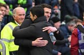 John Mousinho hugs Arsenal manager Mikel Arteta in an FA Cup tie which saw Pompey's head coach bring up his 150th game in charge. Picture: Graham Hunt/ProSportsImages