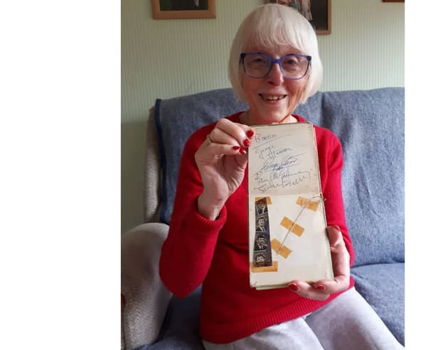 Elizabeth Salt, 79 of Lichfield, with her autograph book stuffed full of 60s icons that she collected as teenager in Portsmouth.