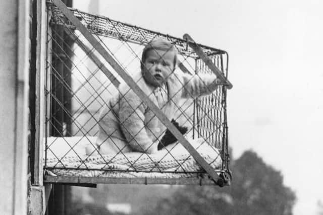 An example of the wire cages attached to windows that parents living in flats were advised to keep their babies in during the 30s to ensure they get enough fresh air and sunlight