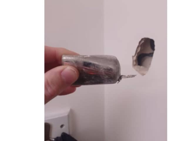 A part of the device was fired into a wall in another room during the explosion.