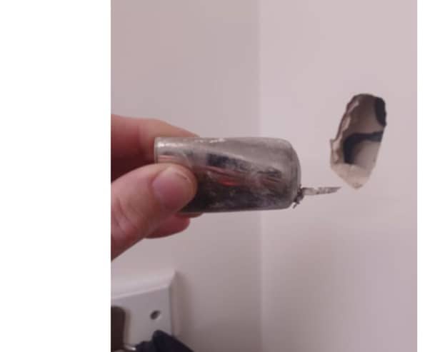 A part of the device was fired into a wall in another room during the explosion.