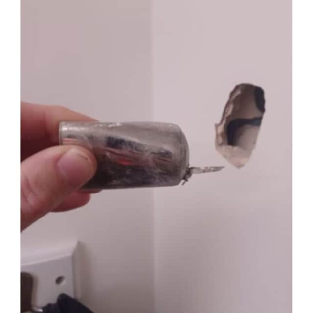 A part of the device was fired into a wall in another room during the explosion.