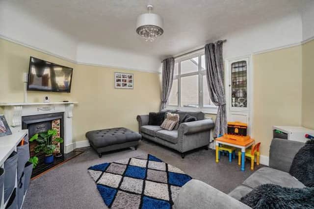 Two well-proportioned reception rooms provide flexible living and dining space for modern family life