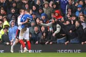 12 supporters have been named and shamed for disorder at the South Coast Derby between Portsmouth and Southampton at Fratton Park. Pictured: Zak Swanson and Flynn Downes clash in the incident the Pompey man believes inspired his side's south-coast derby fightback with Southampton.