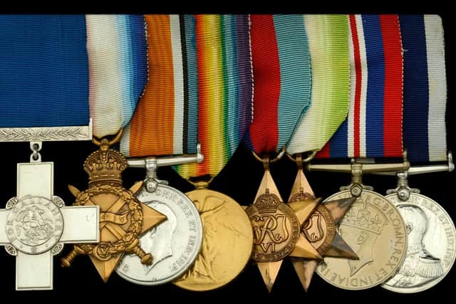 Chief Petty Officer Reginald Vincent Ellingworth and his George Cross (far left) and his other medals including a 1914-15 Star, British War and Victory Medals, a 1939-45 Star, Atlantic Star, War Medal 1939-45, and a Royal Navy Long Service & Good Conduct medal.