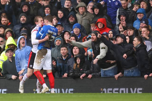 Zak Swanson grapples with Southampton Flynn Downes in Sunday's 1-1 draw - which also marked his 100th Pompey appearance. Picture: Charlie Crowhurst/Getty Images