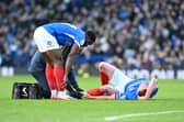 Colby Bishop gets treatment on his ankle during the second half of Saturday's victory against WBA