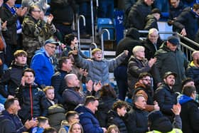 Pompey fans roared their team on to a big Championship win over West Brom.
