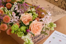 The blooms are carefully wrapped and boxed for delivery.