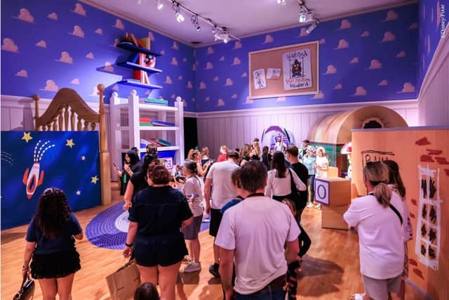 Toy Story fans can shrnk to toy size for a walk through Andy's Room.