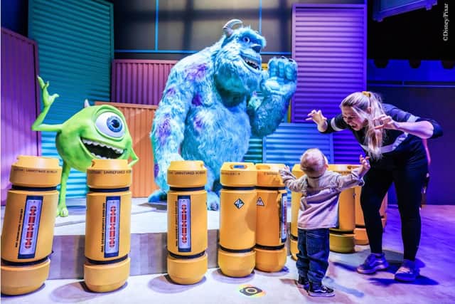 Explore the Scare Floor with with Mike and Sulley at Monsters Inc.