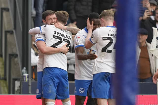 John Swift, left, celebrates scoring in Pompey's 3-1 win at Millwall