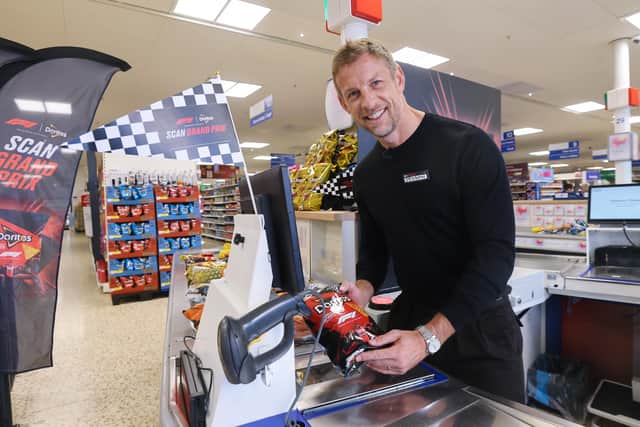F1 World Champion Jenson Button took on shop assistants in a high-octane ‘Scan Grand Prix’.