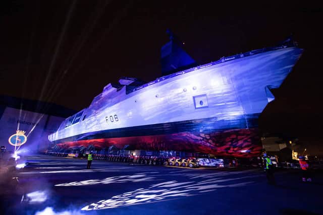 New Type 31 frigate HMS Active being rolled out of the giant Babcock International assembly hall in Rosyth, Scotland.