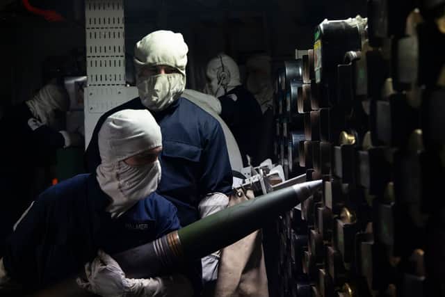 4.5' Gunbay team during the loading of the 4.5' gun onboard HMS Duncan during Exercise Sharpshooter.